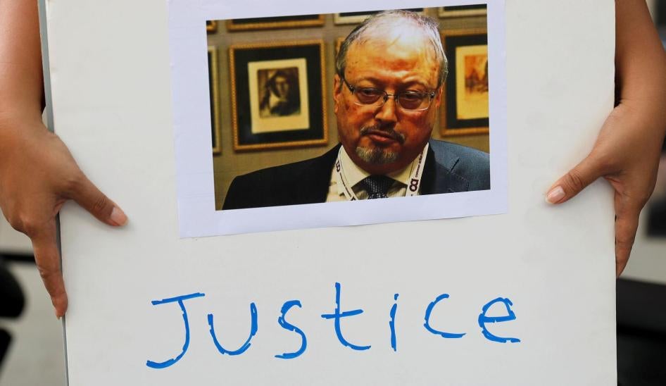 An Indonesian journalist holds a placard during a protest over the disappearance of Saudi journalist Jamal Khashoggi in front of the Saudi Arabia embassy in Jakarta, Indonesia, October 19, 2018. 