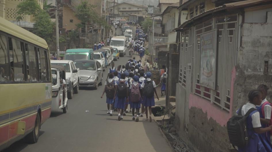 A group of students walk to school in Sierra Leone
