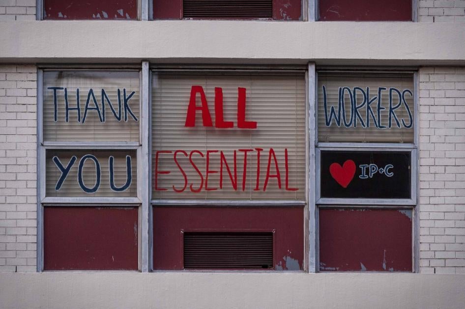 Messages of support for essential workers on a window 