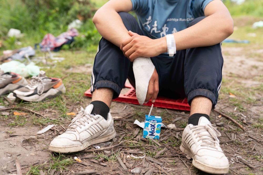 A shot of a teen wearing a blurred out wristband