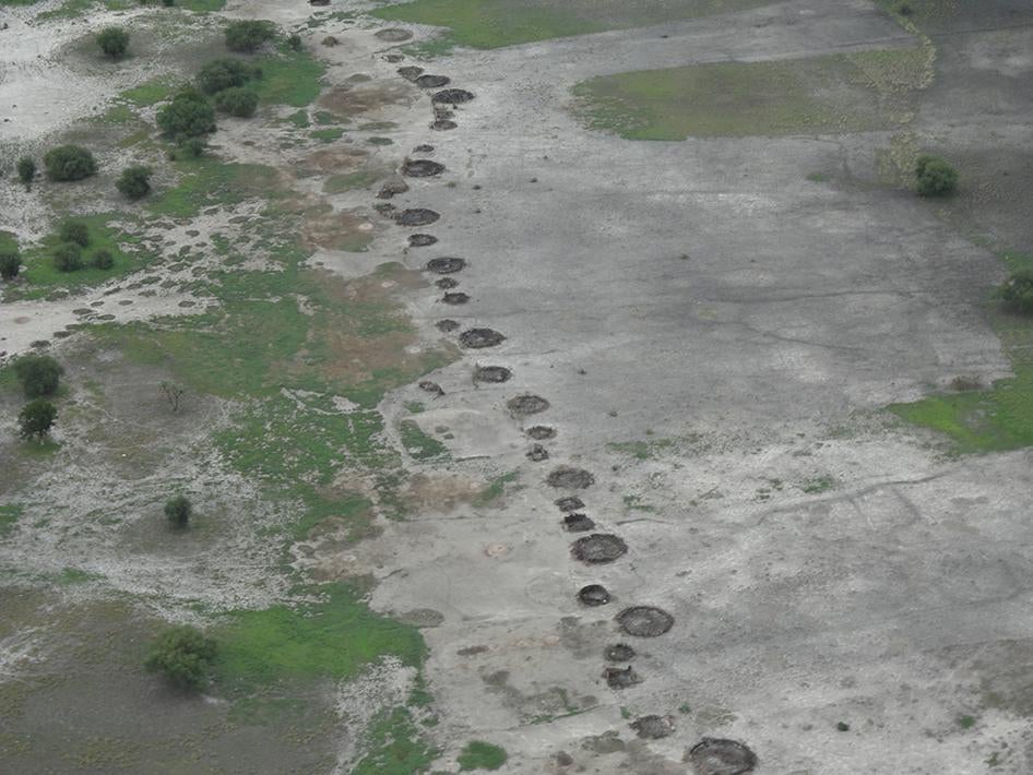 An aerial image taken in June of a line of huts to the north of the town of Guit that had been burned down. Government forces had recently burned down buildings in the town of Guit prior to a UN visit in mid-June.