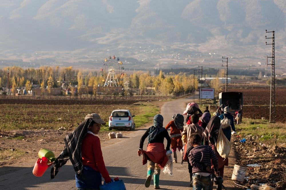 Syrian child agricultural workers at an informal refugee camp in the Bekaa Valley during the potato harvest.