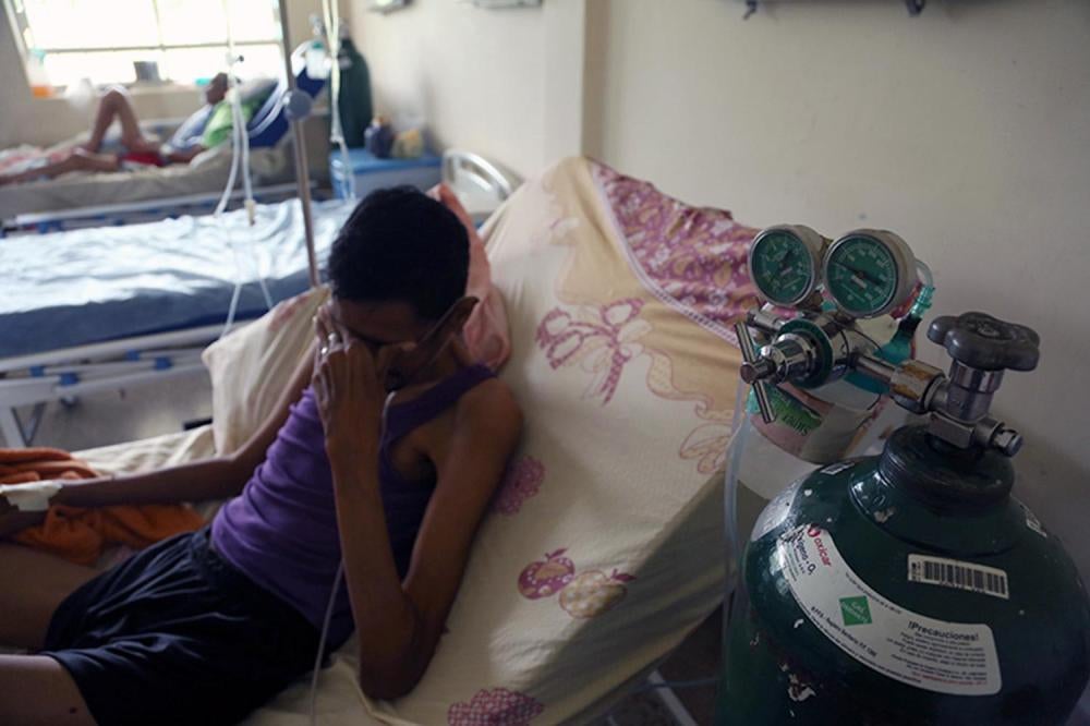 Patients in a hospital in Valencia, Carabobo State, share the last tank of oxygen; without oxygen supplies, doctors are unable to perform many surgeries, July 2016. 