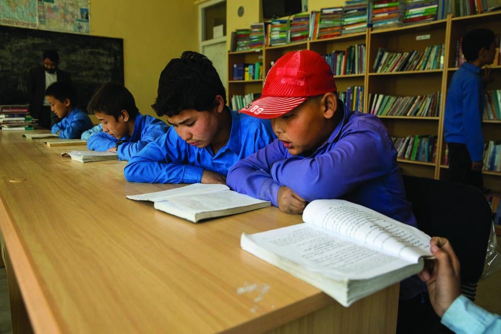 Boys study in the library of their government school in Kabul, Afghanistan. 