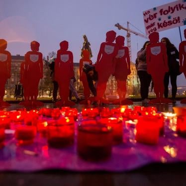 Candles and silhouettes representing victims are placed during a rally to mark the International Day for the Elimination of Violence Against Women outside the Parliament in Budapest, Hungary, November 25, 2018.