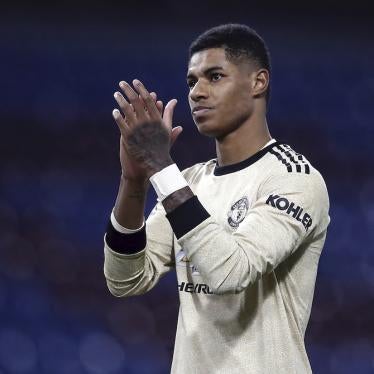 Footballer Marcus Rashford applauds following a game.