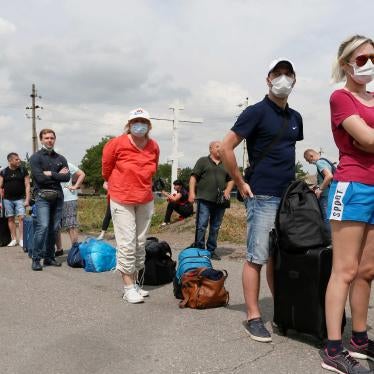People queue before leaving the territory of the self-proclaimed Donetsk People's Republic and crossing a separation line with Ukraine at a checkpoint, which was temporary closed due to the Covid-19 outbreak and then reopened, in Donetsk Region, Ukraine. June 22, 2020.