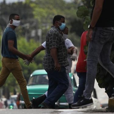 A man is detained at the site where a protest against the killing of a Black man by police was due to take place in Havana, Cuba, June 30, 2020.