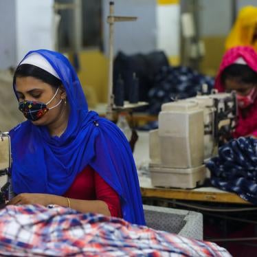 Workers sew clothes in a garments factory in Dhaka, Bangladesh, July 25, 2020.