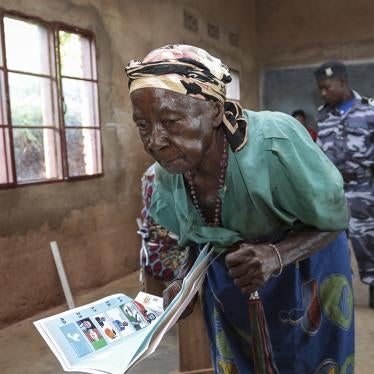 A woman walks to the polling booth to cast her vote in Burundi’s presidential election, in Giheta, Gitega province, on May 20, 2020.