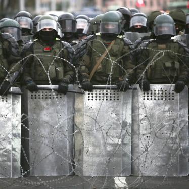 Belarusian police block a street during  opposition rally