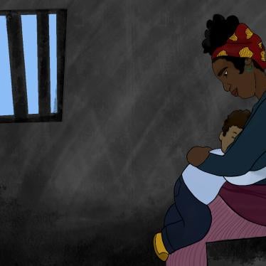 Mother holds child in prison cell
