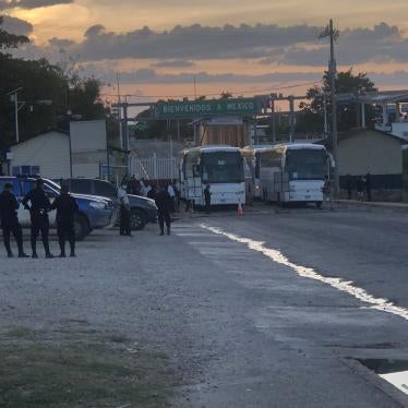 Buses sit on the Mexican side of the El Ceibo border crossing after having expelled migrants into Guatemala.