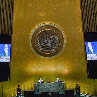 A man on two video screens in the UN general assembly hall