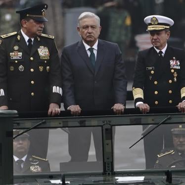 Mexican President Andrés Manuel Lopez Obrador, center, Defense Secretary Luis Crescencio Sandoval, left, and Navy Secretary Vidal Francisco Soberón, right, ride in an open vehicle during the Independence Day military parade in the Zócalo, in Mexico City, on September 16, 2021.