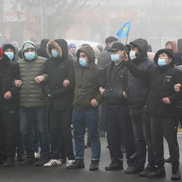 Demonstrators stand in front of a police line during a protest in Almaty, Kazakhstan, January 5, 2022.