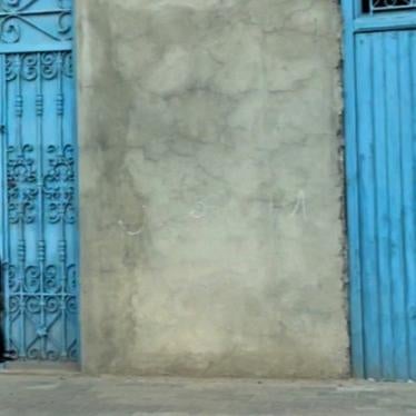 A woman walking on the street in Zarziss, Tunisia.