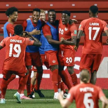 Soccer team celebrates after scoring a goal
