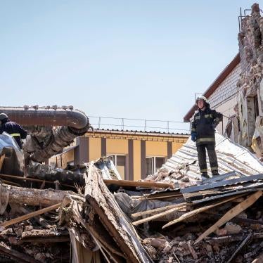 A fireman stands in the ruins of a building destroyed by a Russian cruise missile, which also injured several civilians, in Kharkiv, Ukraine, July 9, 2022.