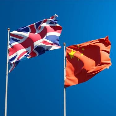 The national flags of the United Kingdom and China together.