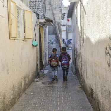 Palestinian children return from school to their homes in the Jabalia Refugee Camp on the 74th Anniversary of Nakba Day in the northern Gaza Strip.