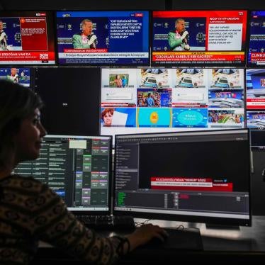 Screens from simultaneous broadcasts by different news channels display Turkish President Recep Tayyip Erdoğan, top, speaking during a rally in the eastern city of Van, on May 5, 2023. Photo taken at Halk TV headquarters.