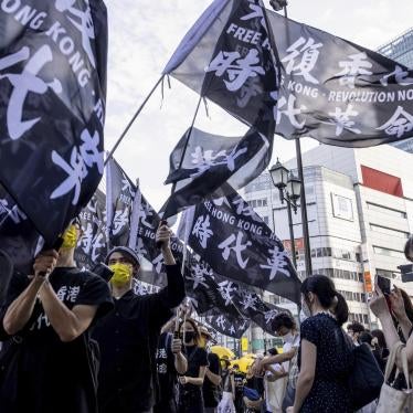 Pro-democracy demonstrators take to the streets in Shinjuku, Japan to mark the second anniversary of the anti-extradition bill movement in Hong Kong, June 12, 2021. 