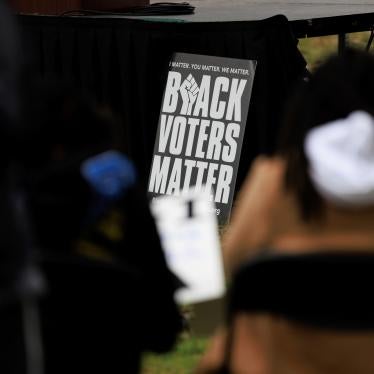 People attend a rally held by the Southern Poverty Law Center near the U.S. Capitol on October 4, 2022