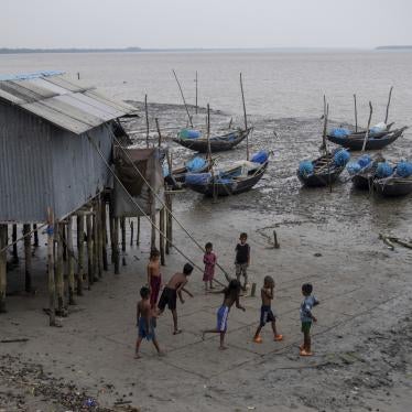 Children playing along the broken bank of the Shibsha River at Dakop Upazilla, Khulna, Bangladesh, August 26, 2023. 