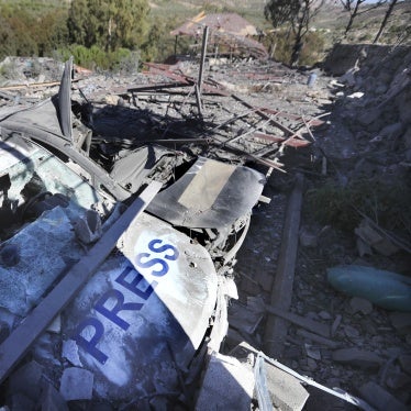 Two destroyed vehicles and a demolished building where three journalists were killed in an Israeli airstrike at the Hasbaya Village Resort, in sourthern Lebanon on October 25, 2024.