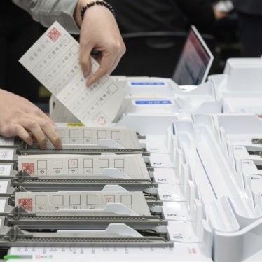 An official demonstrates the ballot counting process using a ballot sorting machine during a simulation of the presidential election voting and counting procedures at South Korea's National Election Commission, April 10, 2025. 