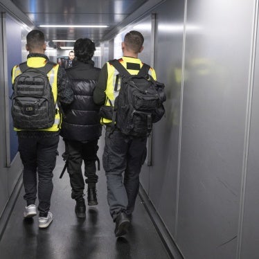 Officers from the German Federal Police take a man on a deportation flight to Pakistan. Frankfurt, February 25, 2025.
