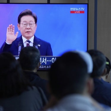 People watch a live broadcast of the inauguration ceremony of South Korean President Lee Jae-myung at the Seoul Railway Station