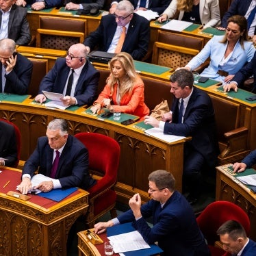 Hungarian Prime Minister Viktor Orban (bottom - C) and Deputy Prime Minister Zsolt Semjen (bottom L) attend the vote to start the withdrawal process from the International Criminal Court (ICC) in Budapest, Hungary, May 20, 2025.