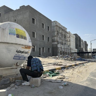 A construction worker washes his hands and face at the end of his working shift in Al Farwaniyah, Kuwait, August 8, 2024. 