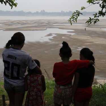Residents look out at the Madeira River, a tributary of the Amazon River, amid a drought in Humaita, Brazil, September 7, 2024.