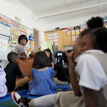 A preschool teacher reads to students at Dorothy I. Height Elementary School in Baltimore, Maryland, US, October 3, 2024.