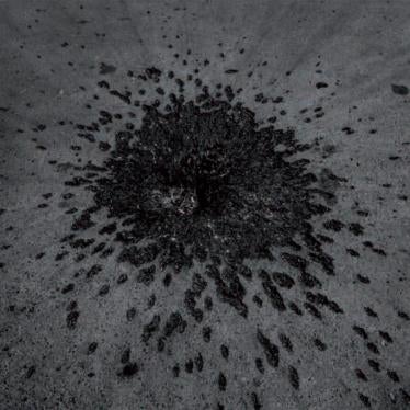 A crater and fragmentation marks consistent with a cluster muntion strike remain five days after an August 12, 2008, attack on the main square of Gori, Georgia. Russia struck the square with an Iskander cluster munition missile, killing six civilians and 