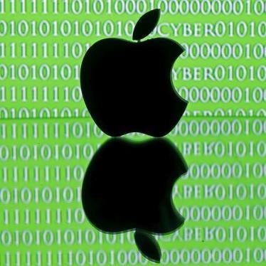 A 3D printed Apple logo is seen in front of a displayed cyber code in this illustration taken February 26, 2016.