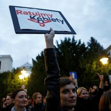 Woman holds a placard as she takes part in an abortion rights campaigners' demonstration in front of the Parliament in Warsaw, Poland September 22, 2016. The placard reads: "Let's save women".