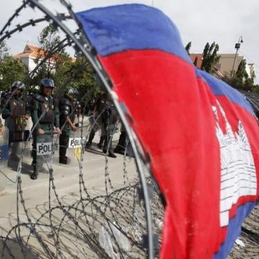 Police officers stand guard at Freedom Park during the demonstration in Phnom Penh on July 15, 2014. 