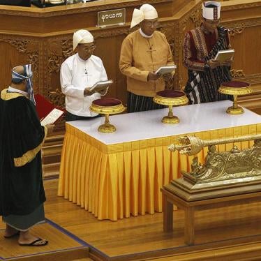 Myanmar's first Vice President Myint Swe, President Htin Kyaw, and second Vice President Henry Van Thio attend their swearing-in at parliament in Naypyidaw on March 30, 2016. 