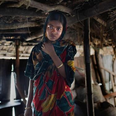 Thirteen-year-old Sifola in the home she shares with her husband and in-laws in Bangladesh. Sifola’s parents, struggling with poverty, took her out of school and arranged for her marriage so that the money saved could pay for her brothers’ schooling. © 20