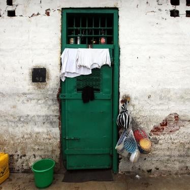 The door of a cell at Lusaka Central Prison. Children are routinely incarcerated in Zambia for minor offenses and frequently held together with adults, putting them at increased risk of sexual violence and other abuses. © 2010 João Silva