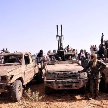 Fighters of the Sudanese Rapid Support Forces in captured vehicles celebrate a victory against the rebel Justice and Equality Movement, Goz Dango, South Darfur, April 28, 2015.   © 2015 Reuters