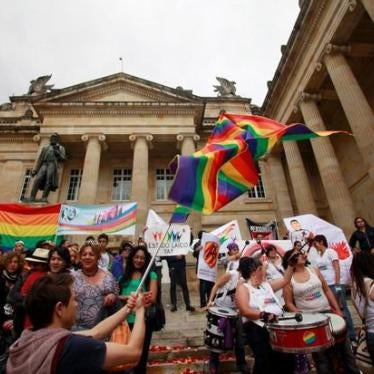 Protesters wave rainbow flags and advocate for LGBT rights outside of the Congress building in Bogotá.