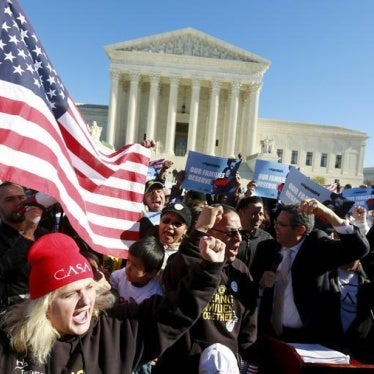 Immigrants and community leaders rally in front of the U.S. Supreme Court to mark the one-year anniversary of President Barack Obama's executive orders on immigration in Washington, November 20, 2015. 