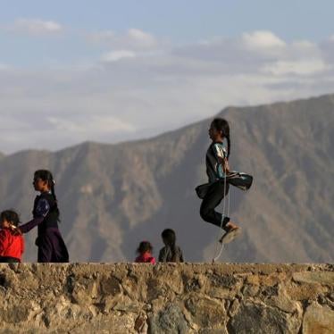 An Afghan girl (R) jumps rope on a hilltop in Kabul, Afghanistan May 18, 2015.