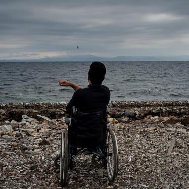 Ali, a 22-year-old Afghan asylum seeker with a disability, living in Moria camp, on the beach in Lesbos, Greece. He told Human Rights Watch he can’t access showers in the camp and sometimes tries to wash himself in the sea. 