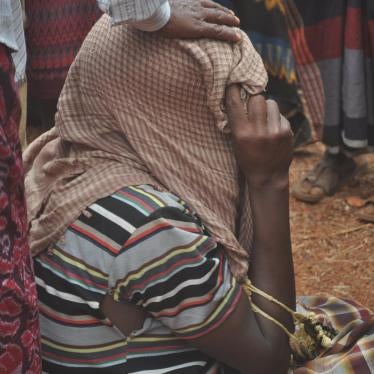A relative mourning the deaths of 14 civilians, including religious leaders, elders, and koranic school teachers, killed in a small village in the Bay region of southwest Somalia. © 2016 Private
